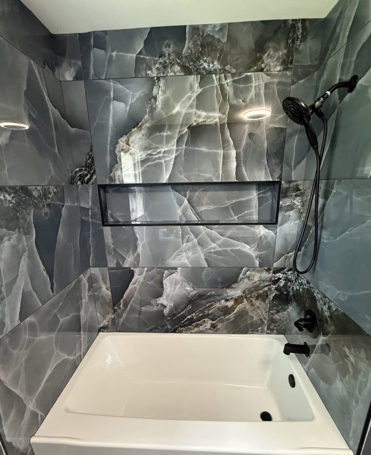 Gallery photos for Modern Bathroom Transformation with Sleek Gray Tiles: Image #1