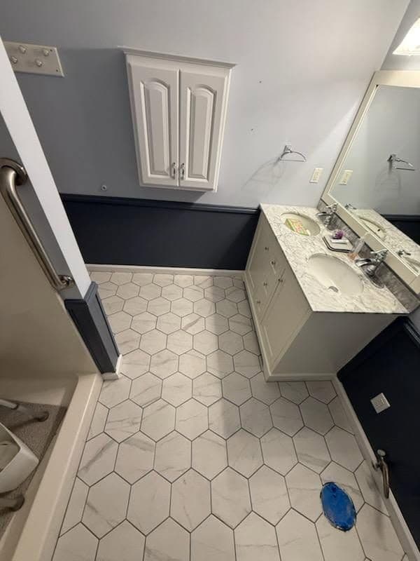 Gallery photos for Elegant Bathroom Makeover with Hexagon Tiles and Dark Wainscoting: Image #1